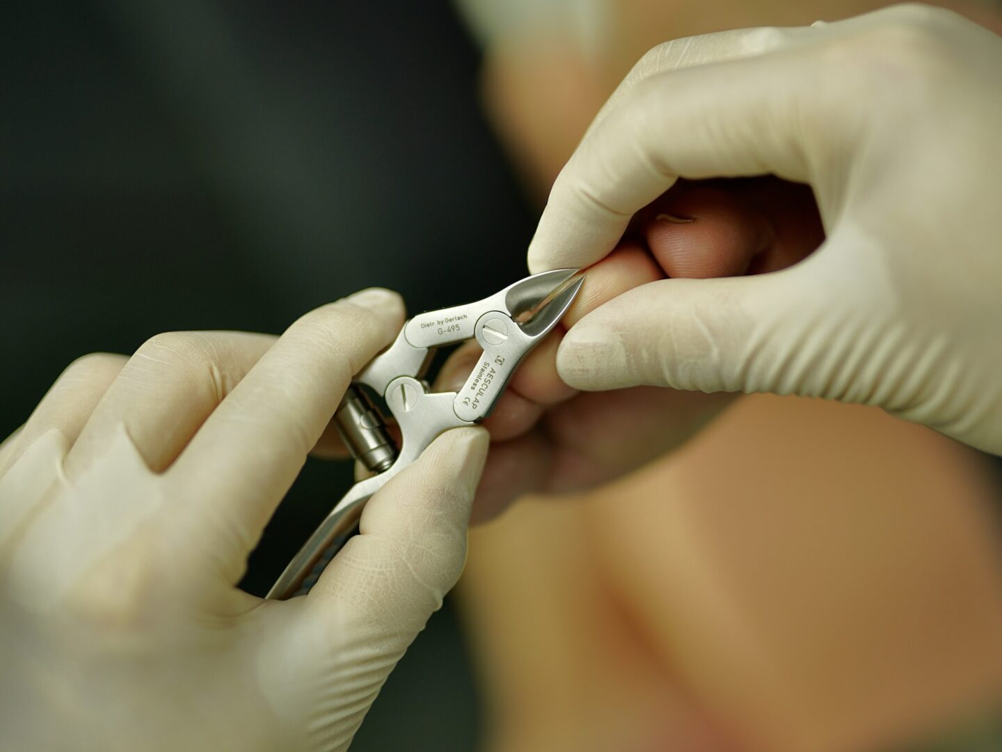 A person is holding scissors in their hands.